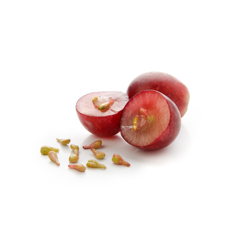 Life Extension, red grapes on white background with grape seeds Infront, in  center of image on white background